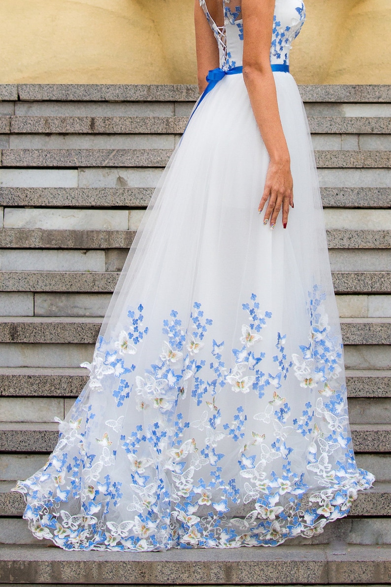 Elegant White Wedding Dress with Blue Accents – Timeless Bridal Style