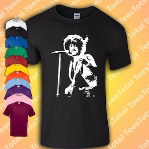 May include: Black t-shirt featuring a white silhouette of a musician singing into a microphone and playing a guitar.