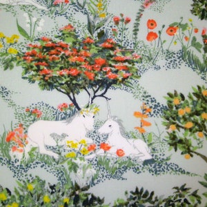 May include: A vintage fabric design featuring two white unicorns in a green and orange floral landscape. The unicorns are facing each other and have gold horns. The background is a light green with orange and red flowers.