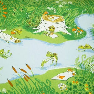 May include: A charming illustration shows a pond scene with green frogs. One frog reads near a tree stump, while others swim and relax. The artwork features a vibrant green and blue colour palette.