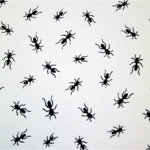 May include: White fabric with a repeating pattern of black ants. The ants are all facing different directions.