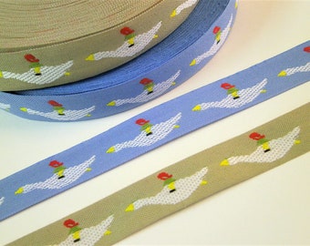 1 m Woven Ribbon "Nils Holgerson flying with goose" 20 mm w 100 % cotton from Sweden