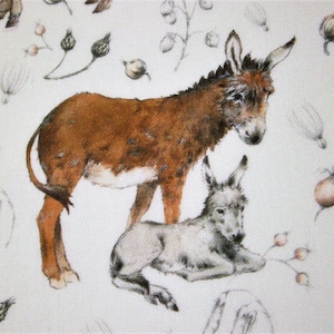 May include: A watercolour painting of two donkeys, one brown and one grey, on a white background with a floral pattern. The brown donkey is standing and the grey donkey is lying down.