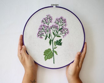 Hand embroidery hoop art with violet flowers