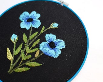 Hand embroidery hoop art with blue flowers