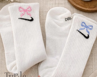 Bow embroidered athletic socks for cheerleaders, teams and schools.  Please see thread chart for color options. Custom designs upon request.