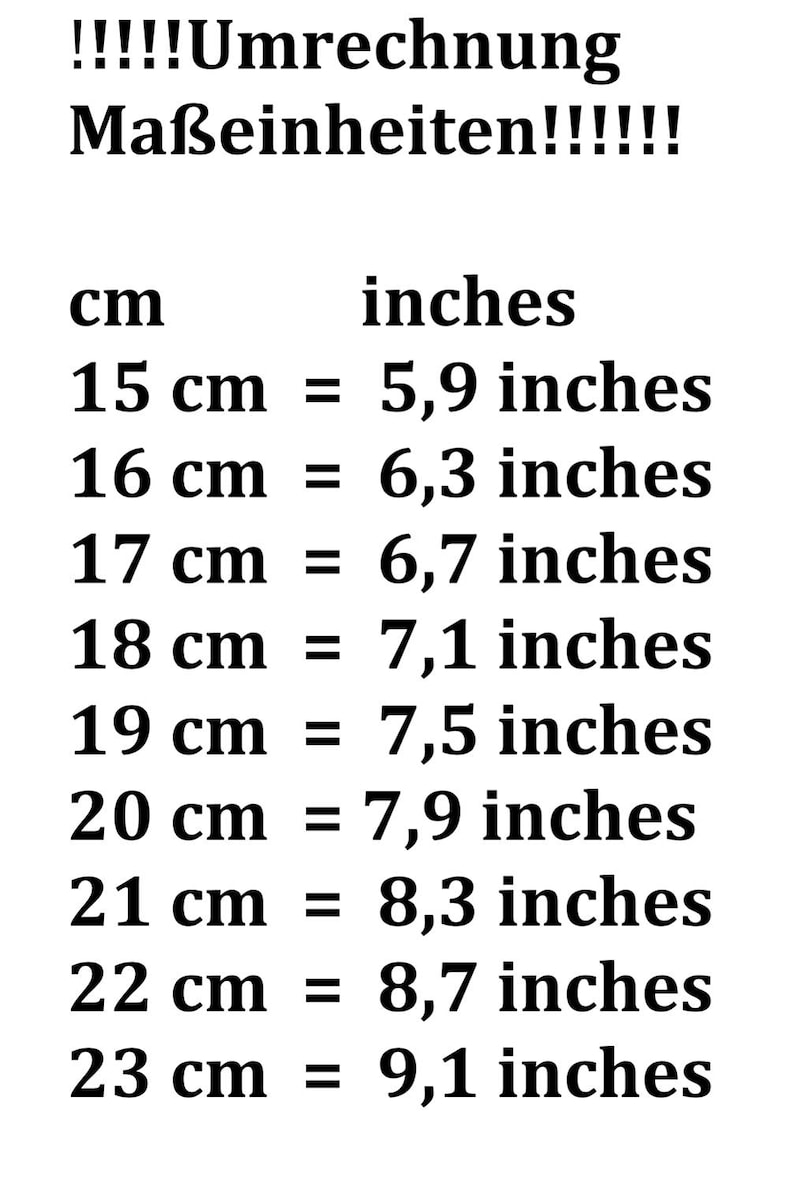 May include: A conversion chart showing the equivalent measurements in inches for centimeters from 15 cm to 23 cm. The chart is written in black text on a white background.