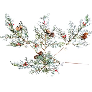May include: Four artificial evergreen branches featuring green cedar-like foliage, small brown pinecones, and clusters of bright red berries. Each branch is attached to a thin brown stem, creating a decorative botanical arrangement.