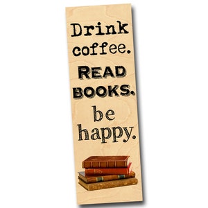 May include: Wooden bookmark with the text "Drink coffee. READ BOOKS. be happy." and a stack of three vintage books.