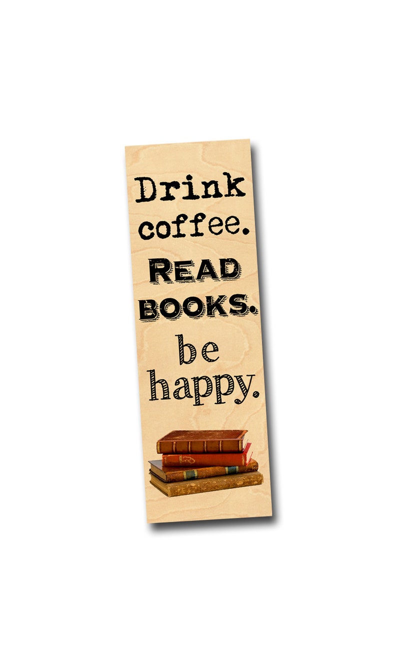 May include: Wooden bookmark with the text "Drink coffee. READ BOOKS. be happy." and a stack of three vintage books.