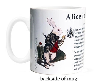 May include: White ceramic mug with a colorful illustration of the White Rabbit from Alice in Wonderland. The mug features the text "Alice in Wonderland" and an excerpt from the book.
