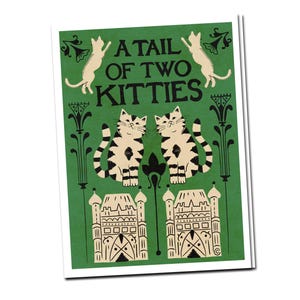 May include: A green art print with the text "A Tail of Two Kitties." The print features two cats, one at the top and two at the bottom, with black and white striped markings. Decorative elements and architectural illustrations complete the design.