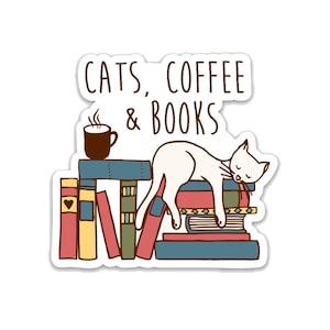 May include: A white cat is sleeping on a stack of colorful books. A cup of coffee with steam coming from it is on a table in front of the cat. The text "CATS, COFFEE & BOOKS" is above the cat.