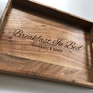 May include: A wooden serving tray with the text "Breakfast In Bed" and "Love Lucy & Jamie" engraved on the surface.