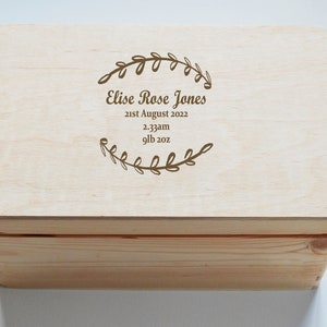 May include: A wooden box with a lid engraved with the name "Elise Rose Jones", the date "21st August 2022", the time "2:33am", and the weight "9lb 2oz".