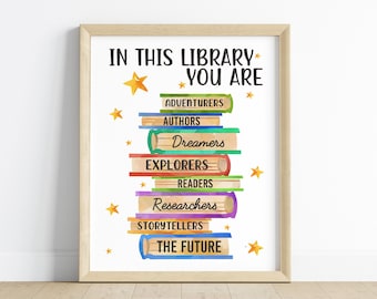 May include: A colourful printable poster with the text "In this library you are" and a stack of books with words like "Adventurers", "Authors", "Dreamers", "Explorers", "Readers", "Researchers", "Storytellers", and "The Future".