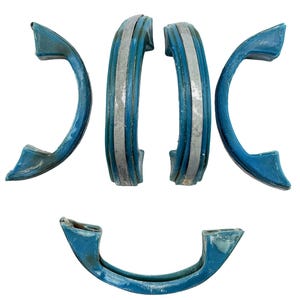 May include: Five semi-circular, curved handles featuring a vibrant blue finish with a central silver-toned stripe. Each handle has a smooth, arched design with distinct mounting points at both ends, showcasing a consistent color and texture.