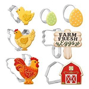 May include: A set of six metal cookie cutters paired with matching decorated cookies. The shapes include a yellow chick, two dotted eggs, a hen, a rooster, a red barn, and a sign with the text FARM FRESH Eggs in black and green lettering.