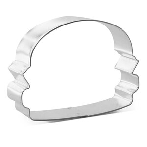 May include: A shiny, silver-colored metal cookie cutter in the shape of a chef's hat. The cutter has a curved top and a wavy brim, perfect for baking themed treats. The cutter is made of a durable metal.