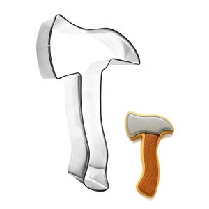 May include: A stainless steel axe-shaped cookie cutter next to a decorated cookie in the shape of an axe. The cookie has a gray axe head and a brown handle with wood grain details. The cutter is a shiny silver color.