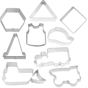 May include: A set of nine metal cookie cutters in various shapes, including a triangle, square, hexagon, vest, hat, cone, truck, and two dump trucks.