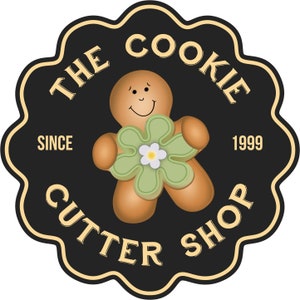 May include: A circular logo for "The Cookie Cutter Shop" featuring a smiling gingerbread man holding a green flower with a white center. The logo is black with gold trim and text, including "Since 1999".