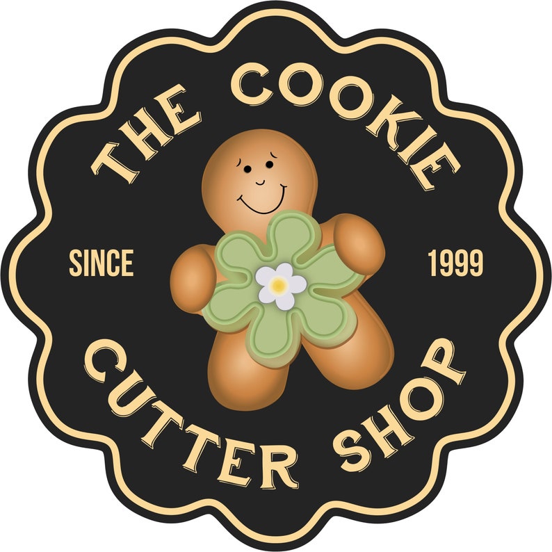 May include: A circular logo for "The Cookie Cutter Shop" featuring a smiling gingerbread man holding a green flower with a white center. The logo is black with gold trim and text, including "Since 1999".