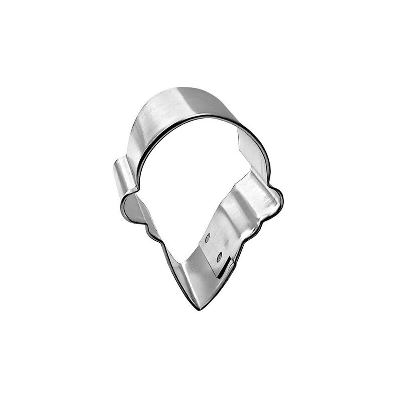 May include: A shiny, silver-colored metal cookie cutter in the shape of an ice cream cone. The cutter has a rounded top and a pointed bottom, with a scalloped edge along the bottom of the cone.
