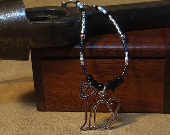 Item #12-26 -Beaded Necklace -  Blue, White, Black and Silver Strand with a Silver Cat