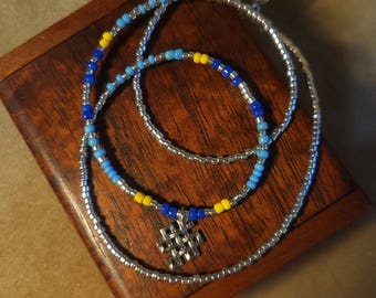 Item #12-34 -Beaded Necklace - Silver Dangle on a Light Blue, Dark Blue, Yellow and Silver Strand