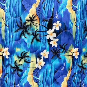 May include: Blue and yellow patterned fabric with palm trees, waves, and the words "Aloha" and "Hawaii" repeated throughout.