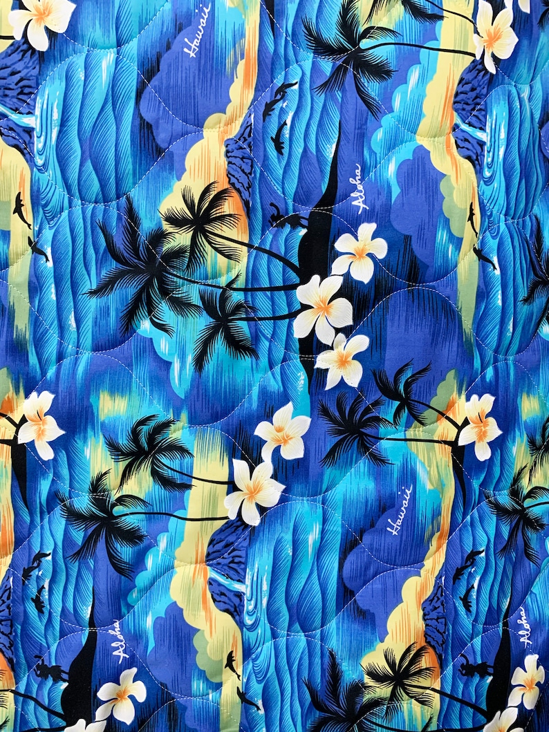 May include: Blue and yellow patterned fabric with palm trees, waves, and the words "Aloha" and "Hawaii" repeated throughout.
