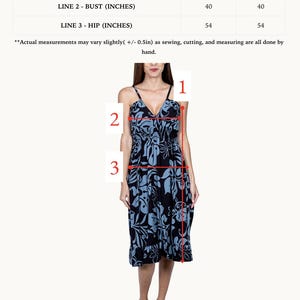 May include: A blue and black floral print maxi dress with a V-neckline and adjustable straps. The dress has a gathered waist and a flowy skirt. The dress is shown in two lengths, short and long. The measurements for each length are listed in inches.