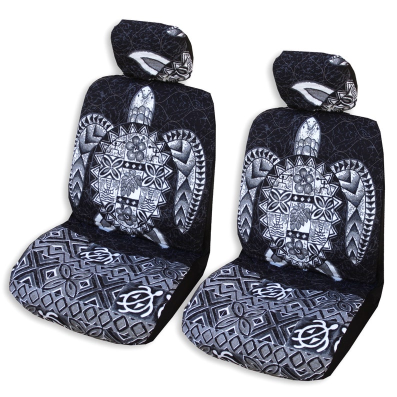 May include: Two black and white car seat covers with a Hawaiian turtle design. The covers feature a large turtle with intricate patterns and a black and white geometric design on the bottom.