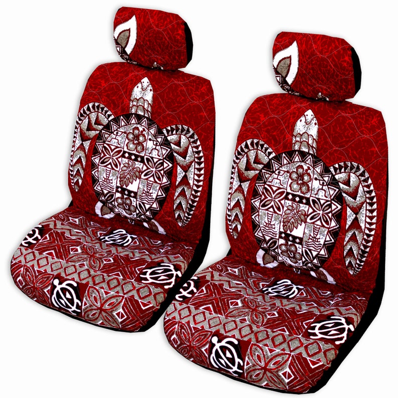 May include: Two red car seat covers with a white turtle design. The turtle has a Polynesian pattern and is surrounded by a white border. The seat covers have a red and white geometric pattern.