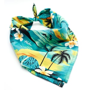 May include: A turquoise blue bandana with a tropical print featuring palm trees, flowers, and the word "Aloha".