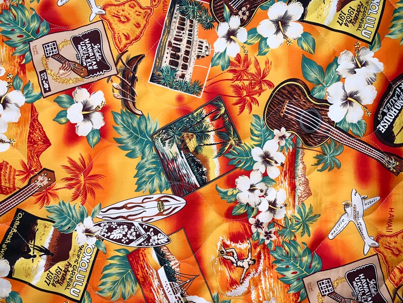 May include: A yellow fabric with a tropical print featuring palm trees, flowers, surfboards, aeroplanes, and ukuleles. The fabric has the text "Konolulu Pacific Carnival February 191624 1917" and "Kilauea No House Hawaii".