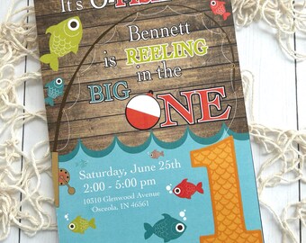 May include: A colorful invitation with a fishing theme. The text reads "It's O-FISH-al... Bennett is REELING in the BIG ONE." Includes event details: Saturday, June 25th, 2:00-5:00 pm, and an address. Features fish illustrations and the number 1.