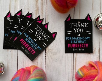 Puede incluir: Etiquetas de agradecimiento en forma de gato negro y rosa con el texto "¡Gracias! Por hacer que mi cumpleaños sea perfecto!! Con cariño, Rylie".