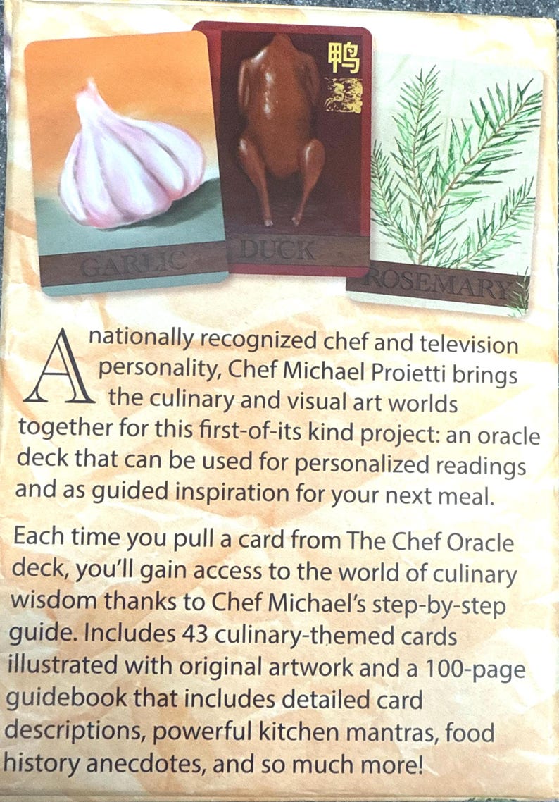 May include: The Chef Oracle deck featuring culinary-themed cards with original artwork. Cards include images of garlic, duck, and rosemary. The deck is designed for personalized readings and culinary inspiration. Includes a guidebook.