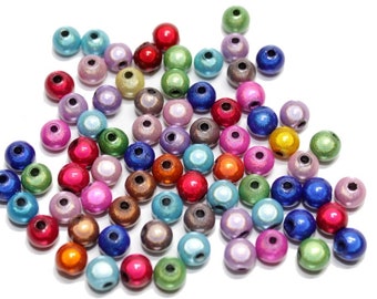 60 Wonderkralen 6 mm van acryl, gemengde kleuren.