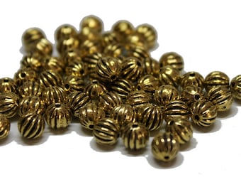 25 Metallperlen gerieft, goldfarben 6mm