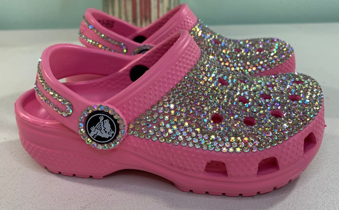 clear pink crocs