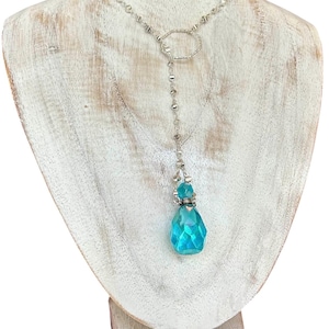 Aqua Aura faceted essential oil, cremation ash pendulum lariat, disc chain & sterling octagon centerpiece.