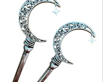 Espada de cabello con forma de media luna de filigrana celestial y estrella polar colgante.