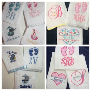 May include: A collage of eight personalized baby burp cloths. The cloths are white with various embroidered designs, including footprints, hearts, monograms, and animals. The names Harrison, Madeline, Blake, GV, Gabriel, Savannah, and a monogram are visible on the cloths.
