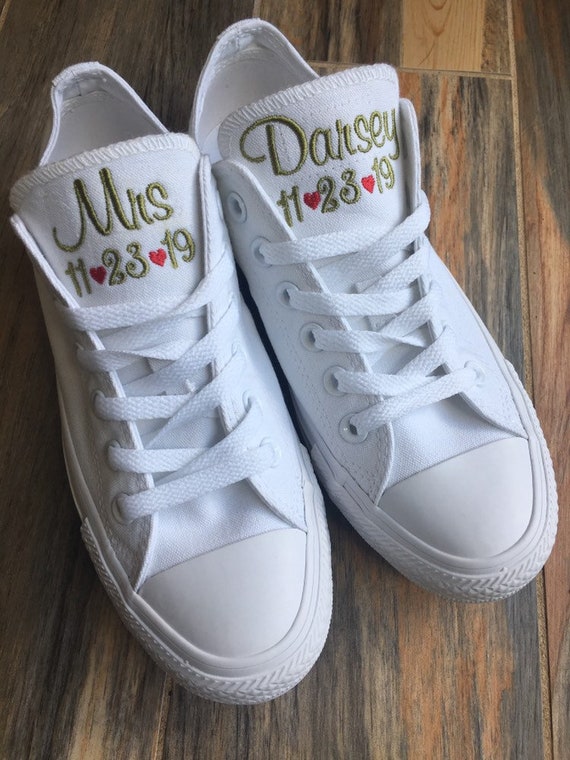 white embroidered converse