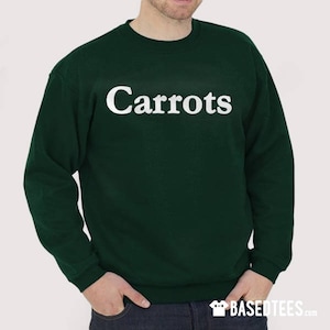 May include: A dark green sweatshirt with the word "Carrots" printed in white on the front.