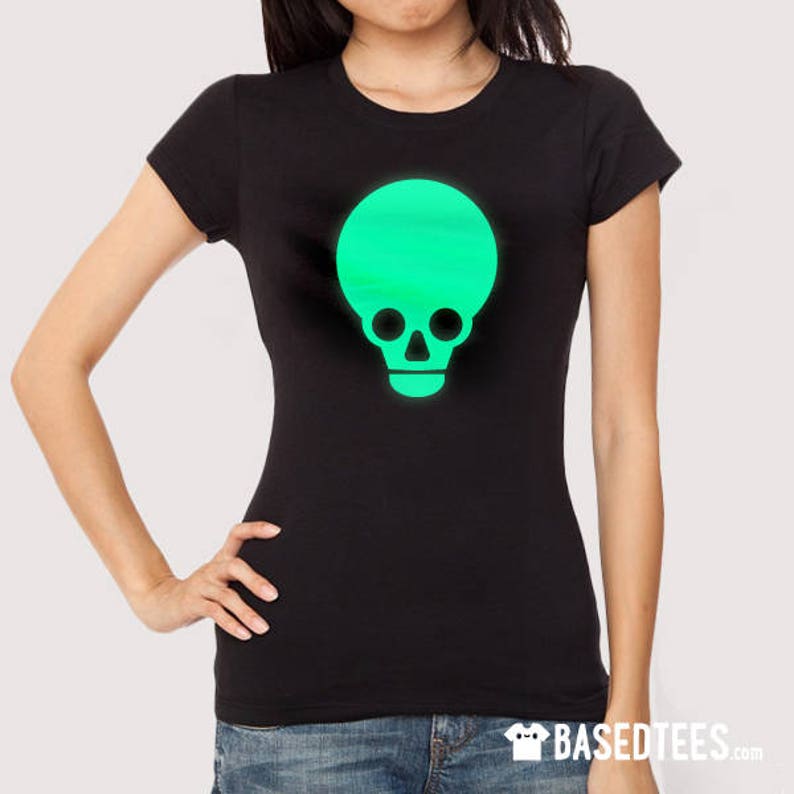 May include: A black t-shirt featuring a green glow-in-the-dark skull graphic.