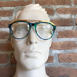 Derapage vintage sunglasses 90s, blue green multicolor frame, gold top bar, NOS demo lenses with original sticker, Italian unisex